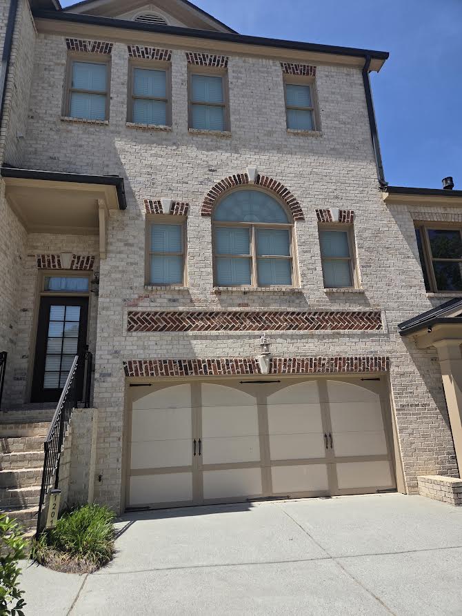 Freshly painted brick home exterior by CDR Contractors Group